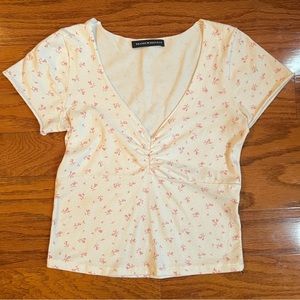 Brandy Melville ivory knit top with tiny flowers. One size